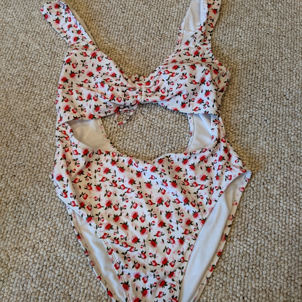 Xhiliration XL one piece with cutouts. Never worn.